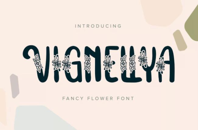 Vignellya fancy flower font showing ornate letters with sophisticated floral vignettes and elegant botanical frames